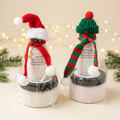 Christmas sugar scrub and lotion sets with warm lights and evergreen accents