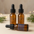KR Farms beard oil with warm holiday lights and evergreen accents