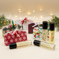 KR Farms roller ball perfumes and festive holders with warm holiday styling